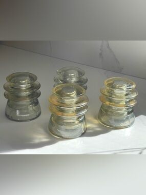 4 vintage Armstrong's T.W. clear glass insulators,